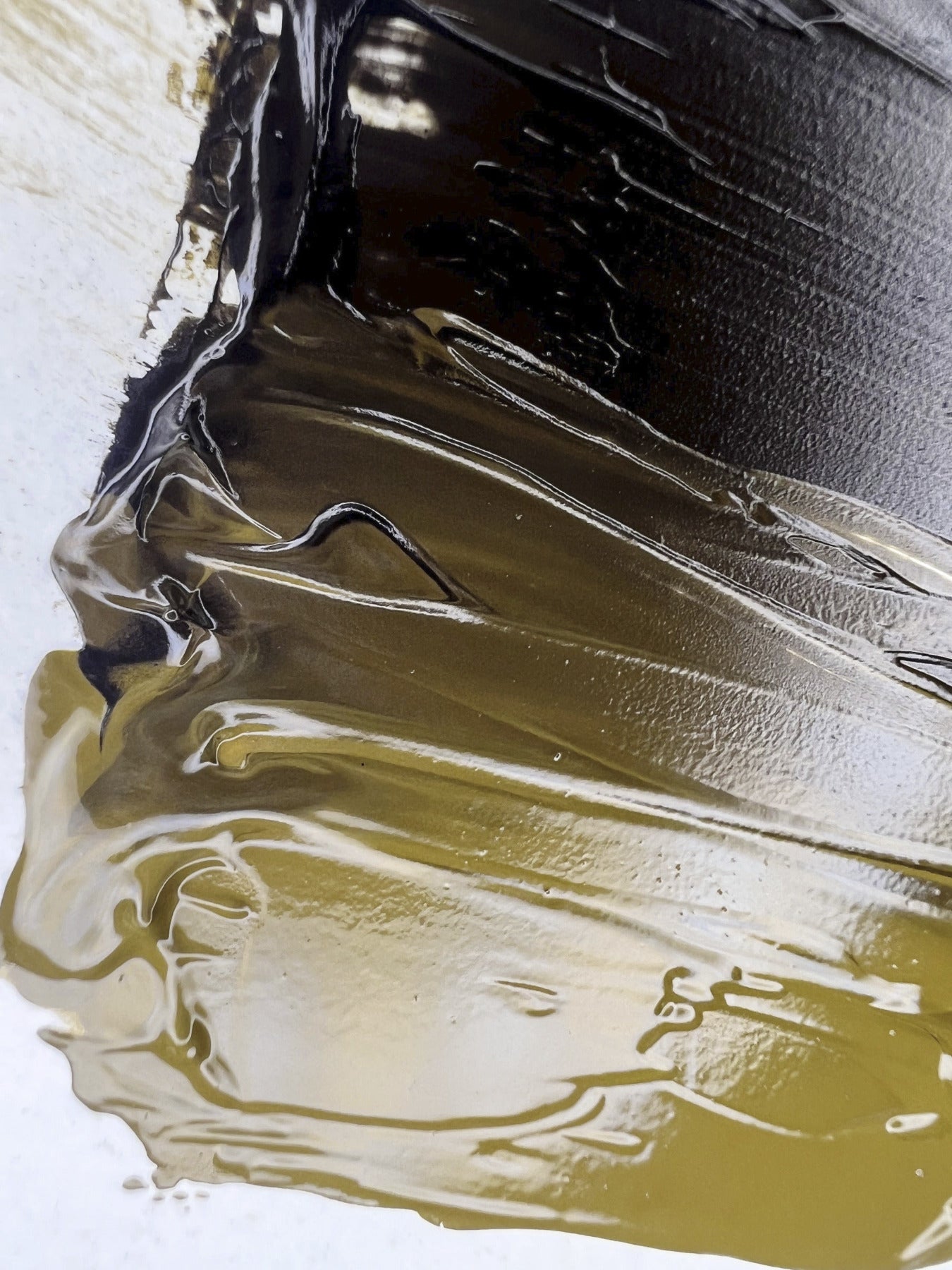 Close-up of SofTap PMU pigments smeared together on white background