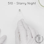 white gloved hand with white brush smearing SofTap black Starry Night Color for permanent eyeliner