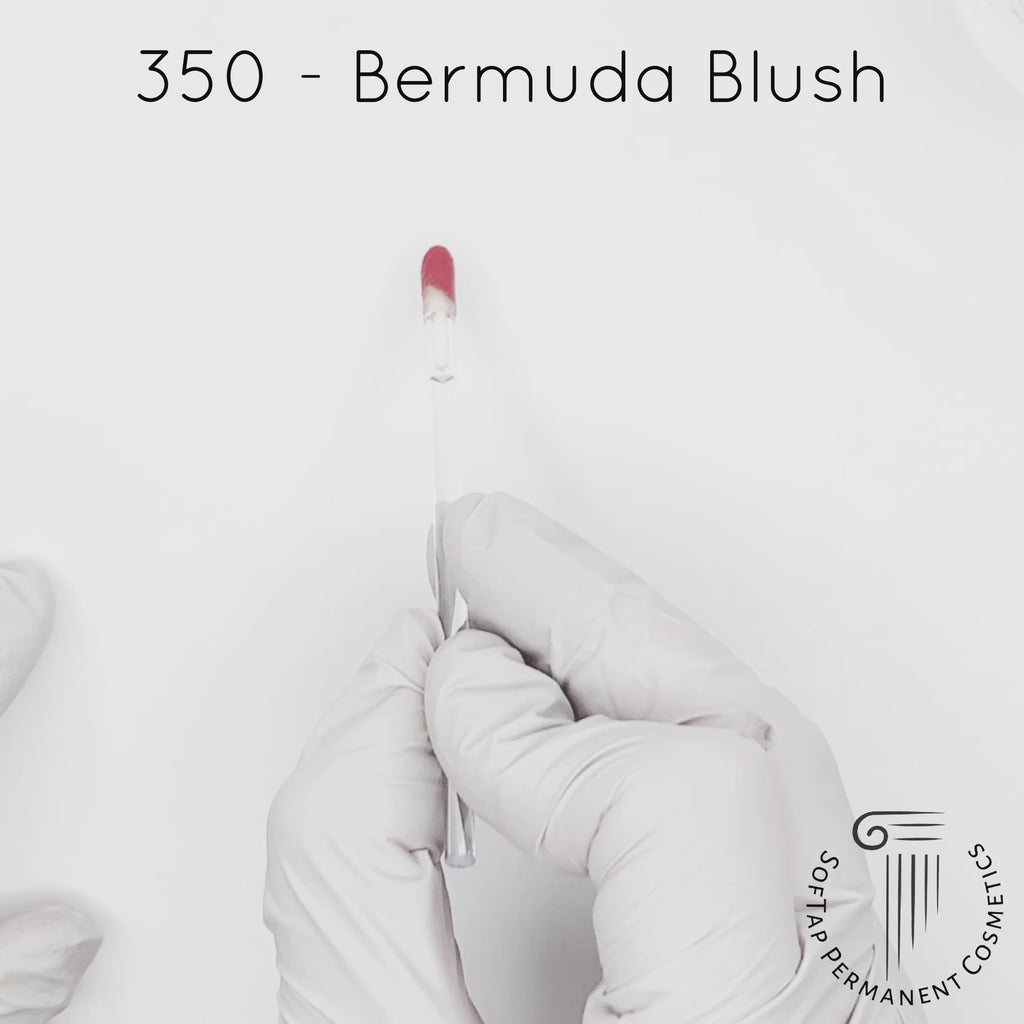 white gloved hand with white brush smearing SofTap natural pink Bermuda Blush Color for permanent lips