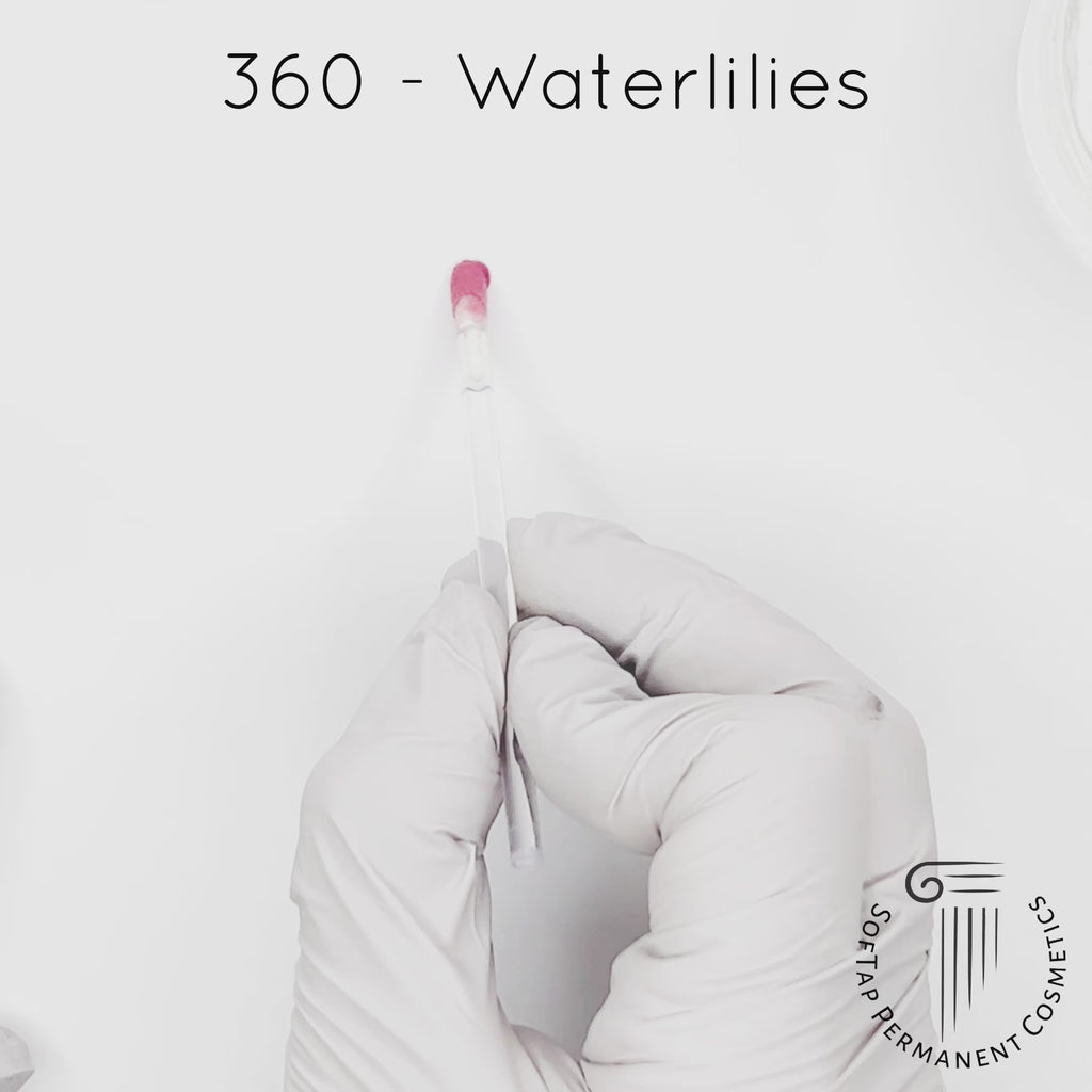 white gloved hand with white brush smearing SofTap pink Waterlilies Color for permanent lips