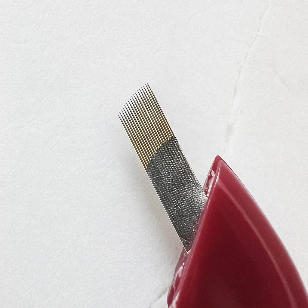 Close-up of SofTap permanent makeup 17 curve nano gauge needle shown against a light textured background.