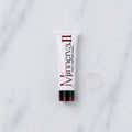 SofTap topical anesthetic Minnerva tube with blob of clear gel on white marble background
