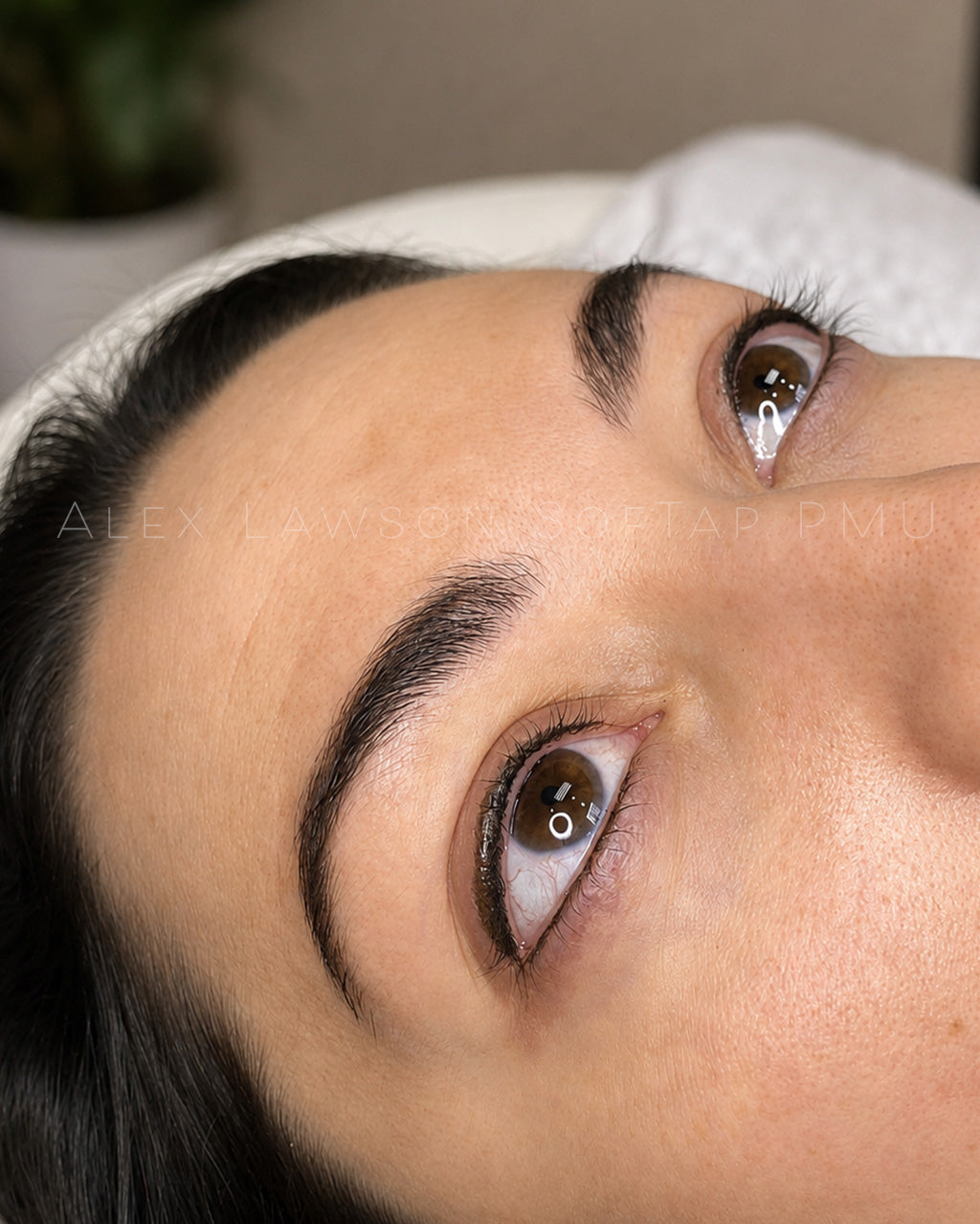 Close-up of a softap permanent makeup two-toned eyeliner with a neutral background