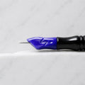 A close-up of SofTap 18 round pmu needle click tip, resting on a white marble surface.
