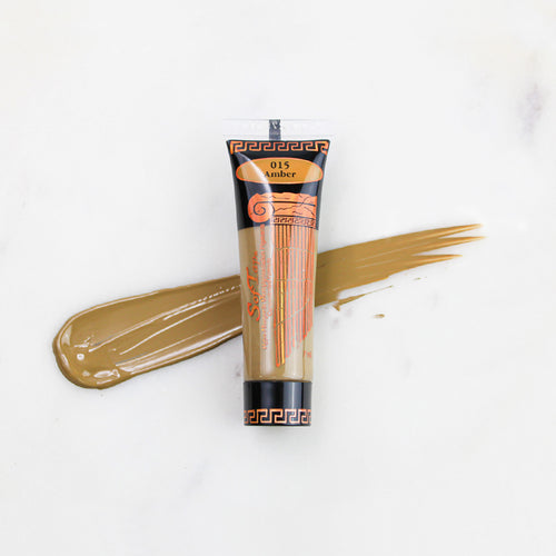 SofTap permanent makeup pigment Amber tube with color swatch on marble background