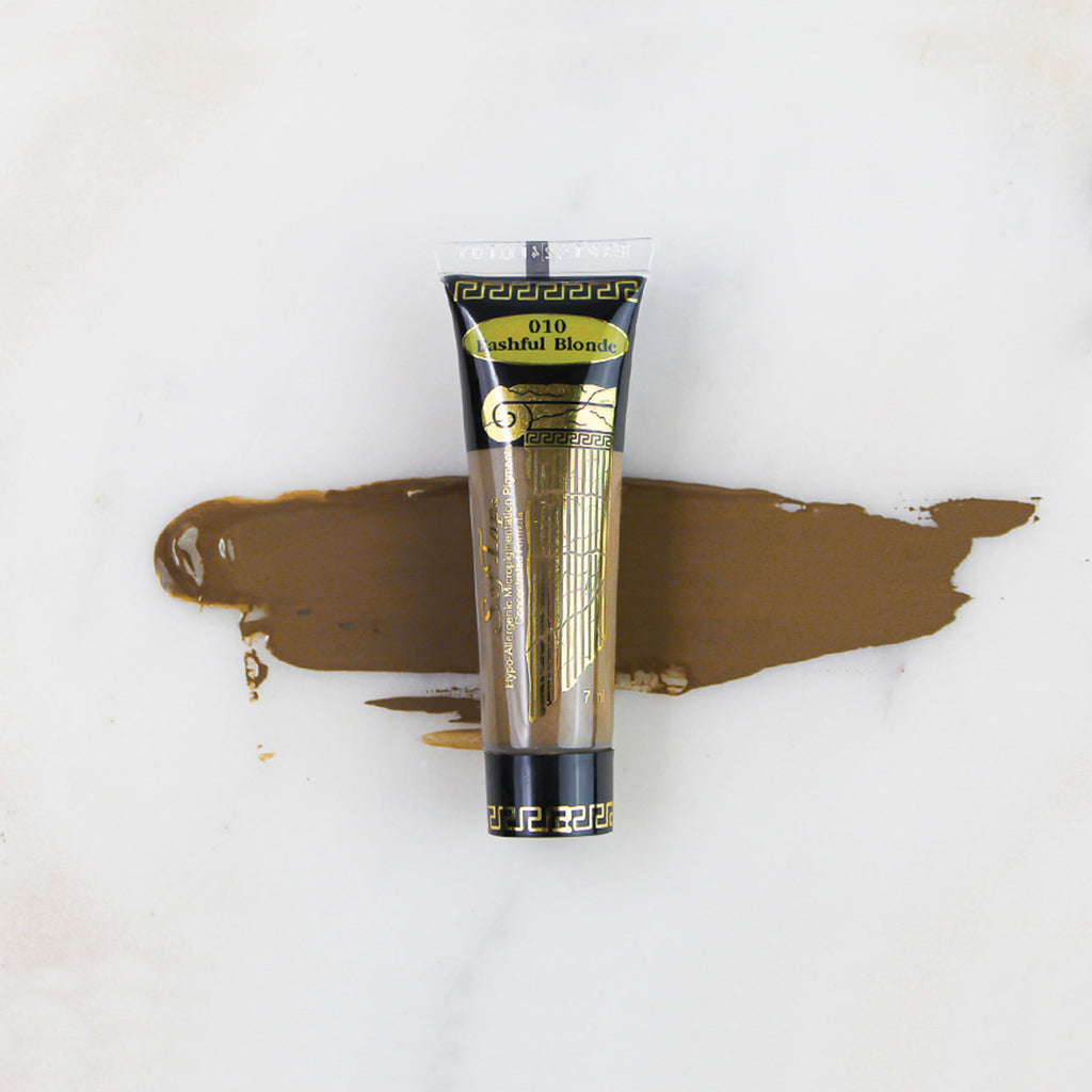 SofTap permanent makeup pigment Bashful Blonde tube with color swatch on marble background