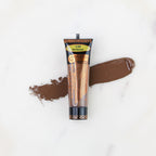 SofTap permanent makeup pigment Bordeaux tube with color swatch on marble background