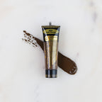 SofTap permanent makeup pigment Cafe Vienna tube with color swatch on marble background