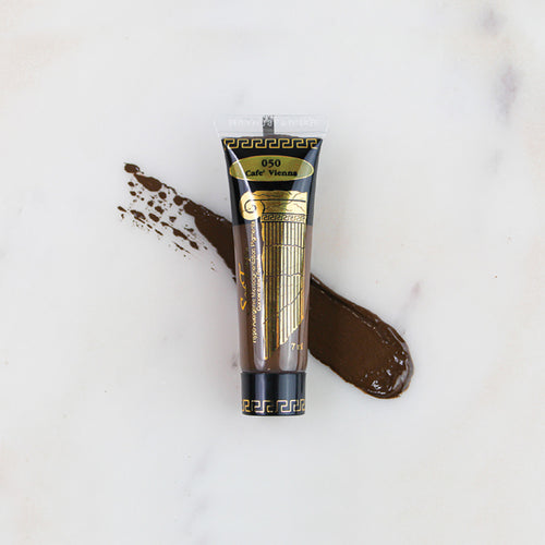 SofTap permanent makeup pigment Cafe Vienna tube with color swatch on marble background