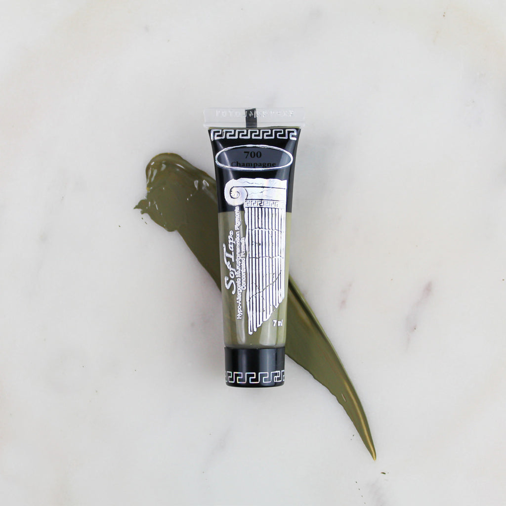 SofTap permanent makeup pigment Champagne tube with color swatch on marble background