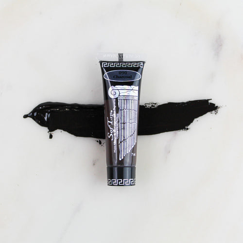 SofTap permanent makeup pigment Charcoal tube with color swatch on marble background