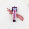 SofTap permanent makeup pigment Cherries Jubilee tube with color swatch on marble background