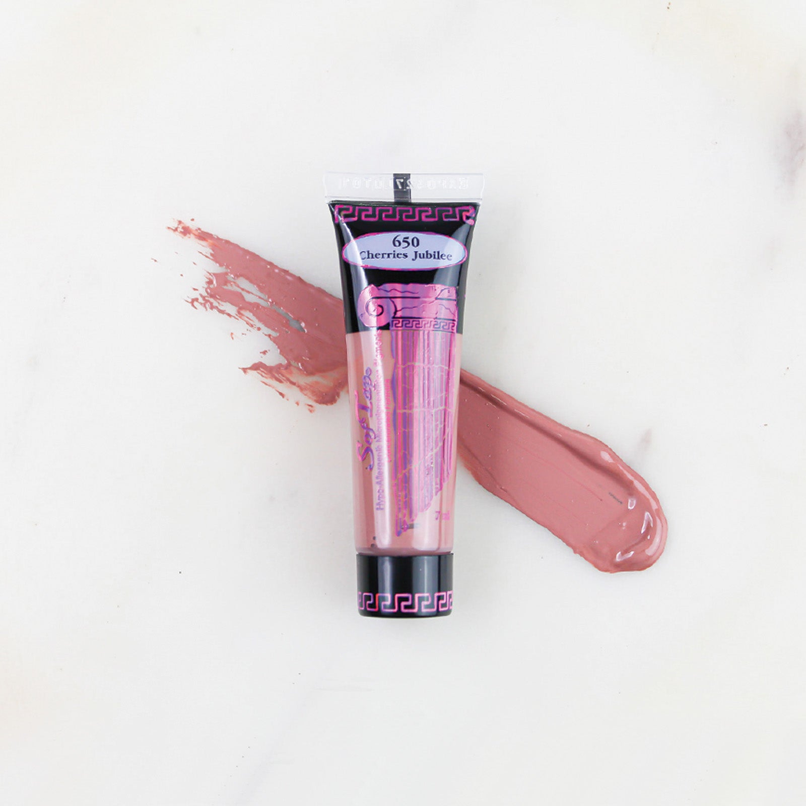 SofTap permanent makeup pigment Cherries Jubilee tube with color swatch on marble background