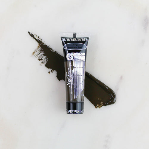 SofTap permanent makeup pigment Chocolate Eclair tube with color swatch on marble background