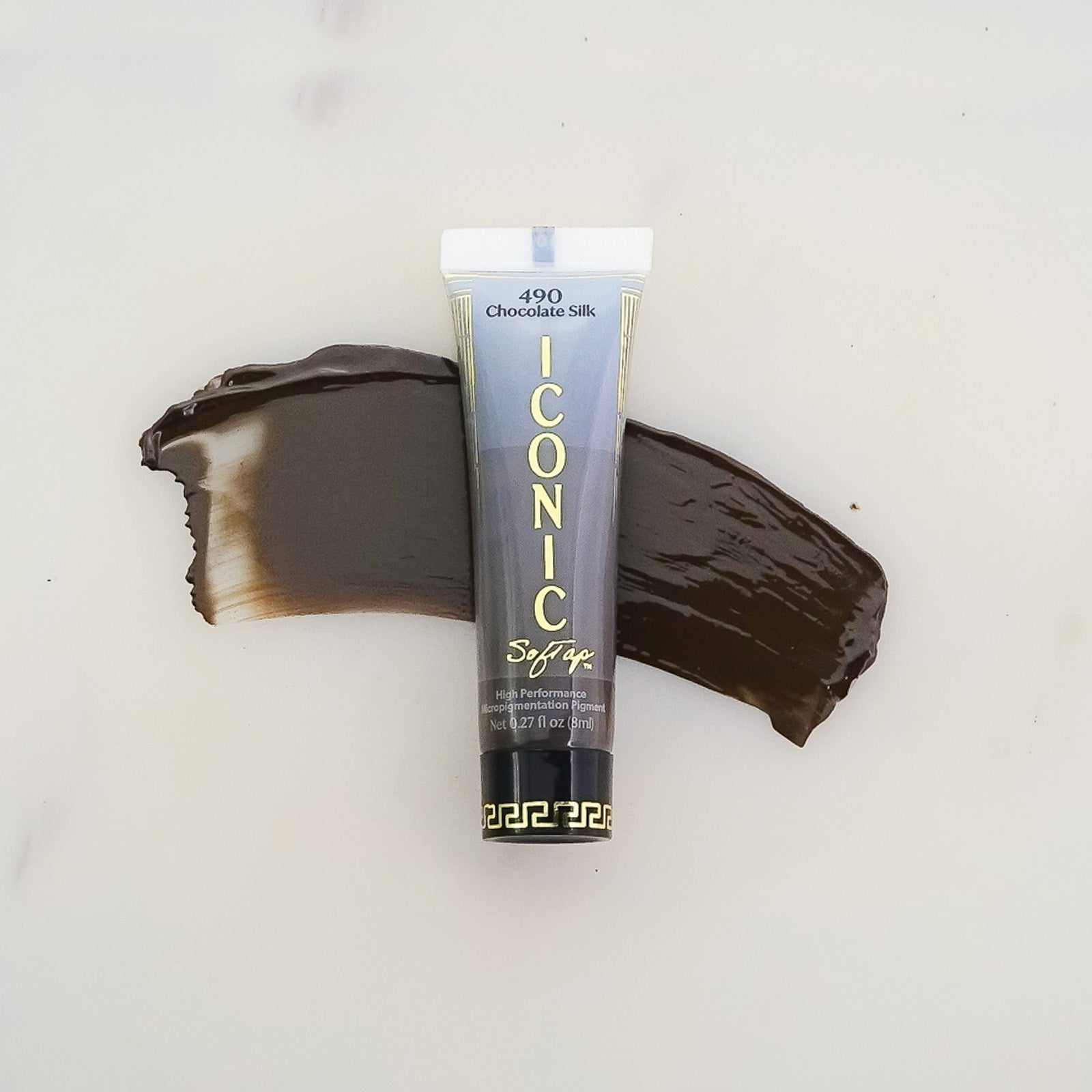 SofTap permanent makeup Iconic pigment Chocolate Silk tube with color swatch on marble background