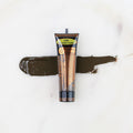 SofTap permanent makeup pigment Chocolate Truffle tube with color swatch on marble background