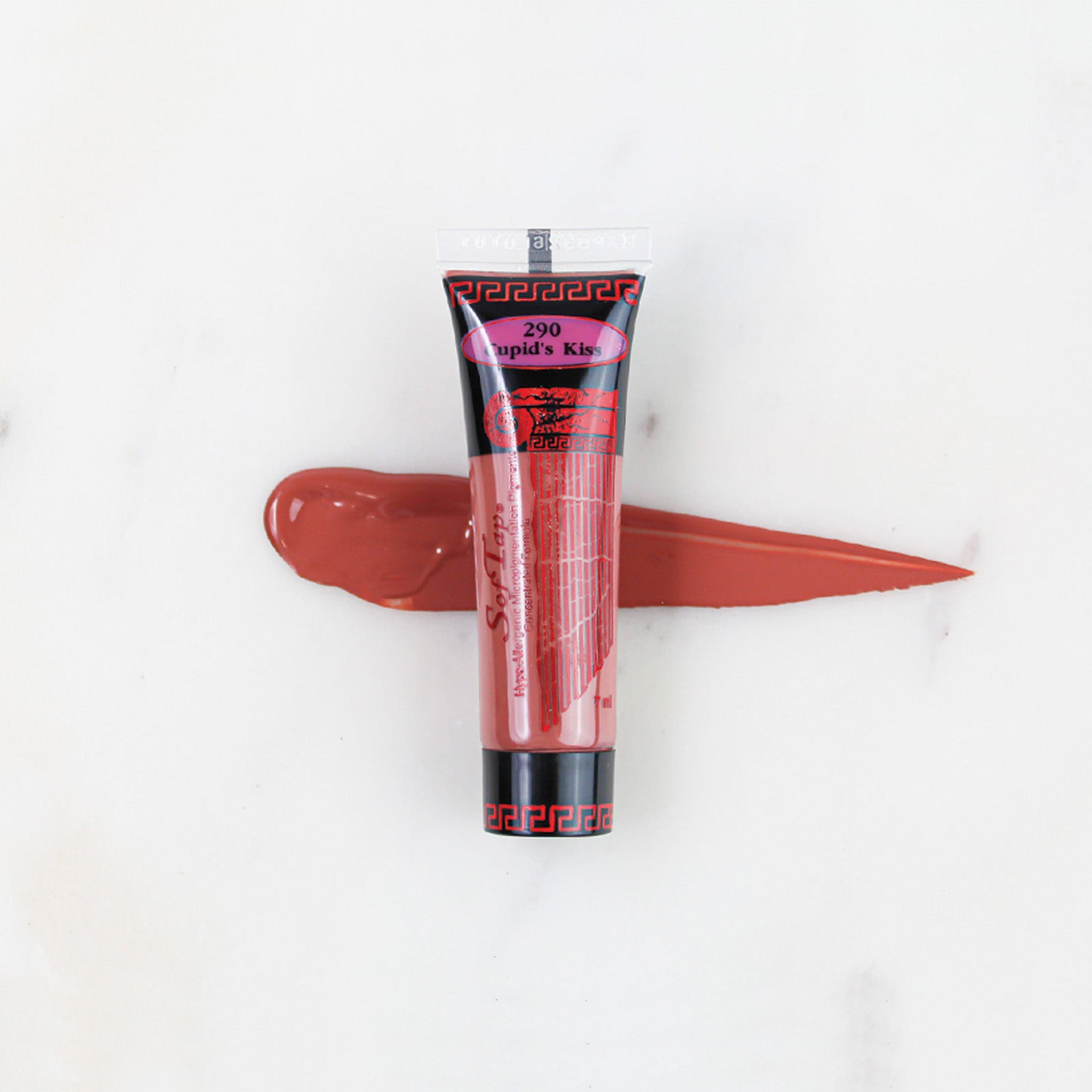 SofTap permanent makeup pigment Cupids Kiss tube with color swatch on marble background