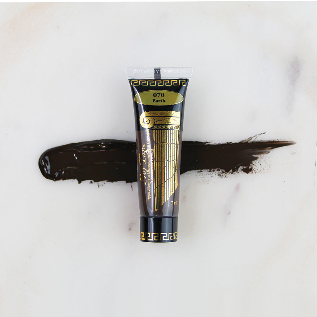 SofTap permanent makeup pigment Earth tube with color swatch on marble background