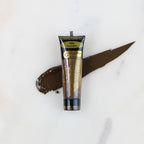 SofTap permanent makeup pigment Espresso tube with color swatch on marble background