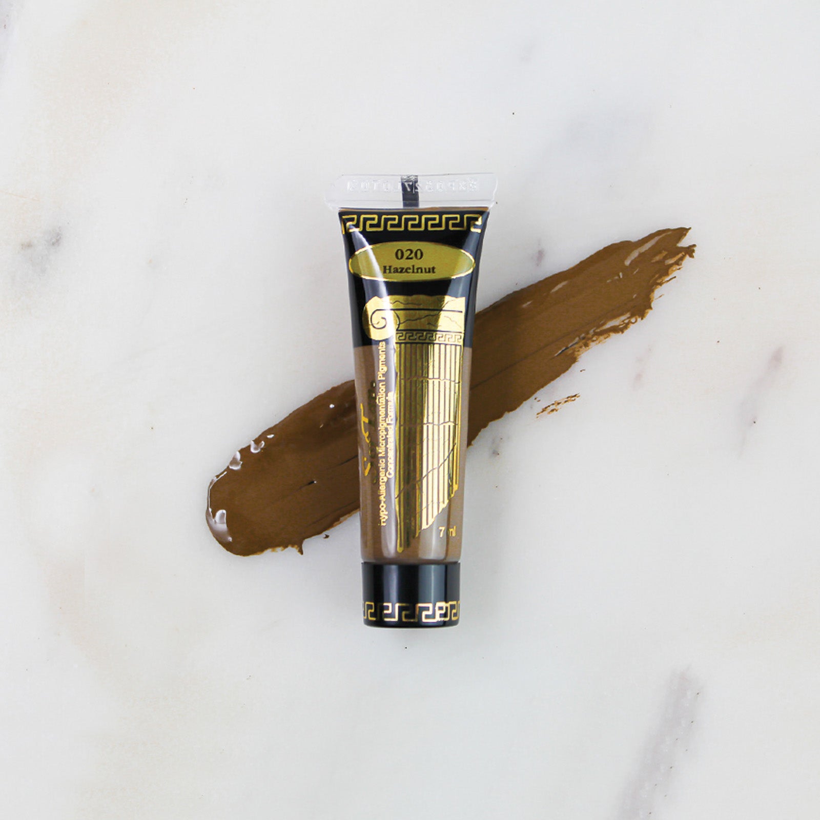 SofTap permanent makeup pigment Hazelnut tube with color swatch on marble background