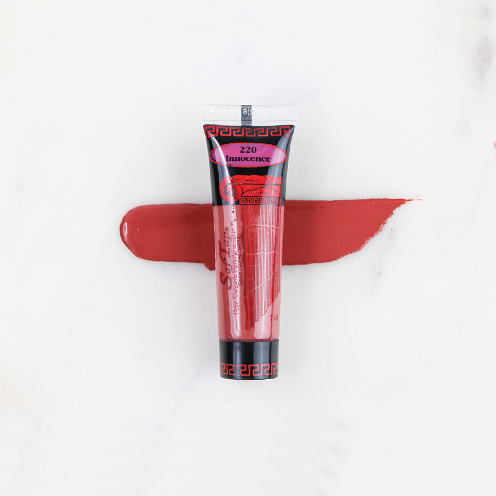 SofTap permanent makeup pigment Innocence tube with color swatch on marble background