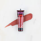 SofTap permanent makeup pigment Jamaican Rum tube with color swatch on marble background