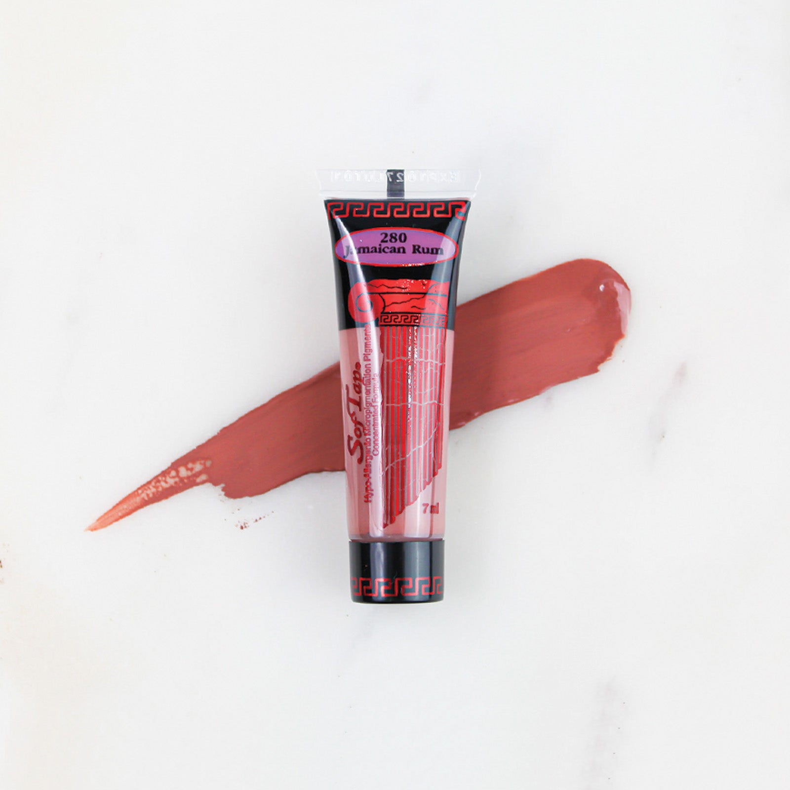 SofTap permanent makeup pigment Jamaican Rum tube with color swatch on marble background
