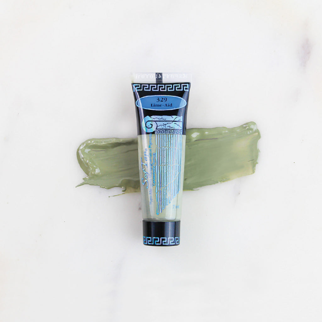 SofTap permanent makeup pigment Lime-Aid tube with color swatch on marble background