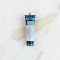 SofTap permanent makeup pigment Porcelain tube with color swatch on marble background