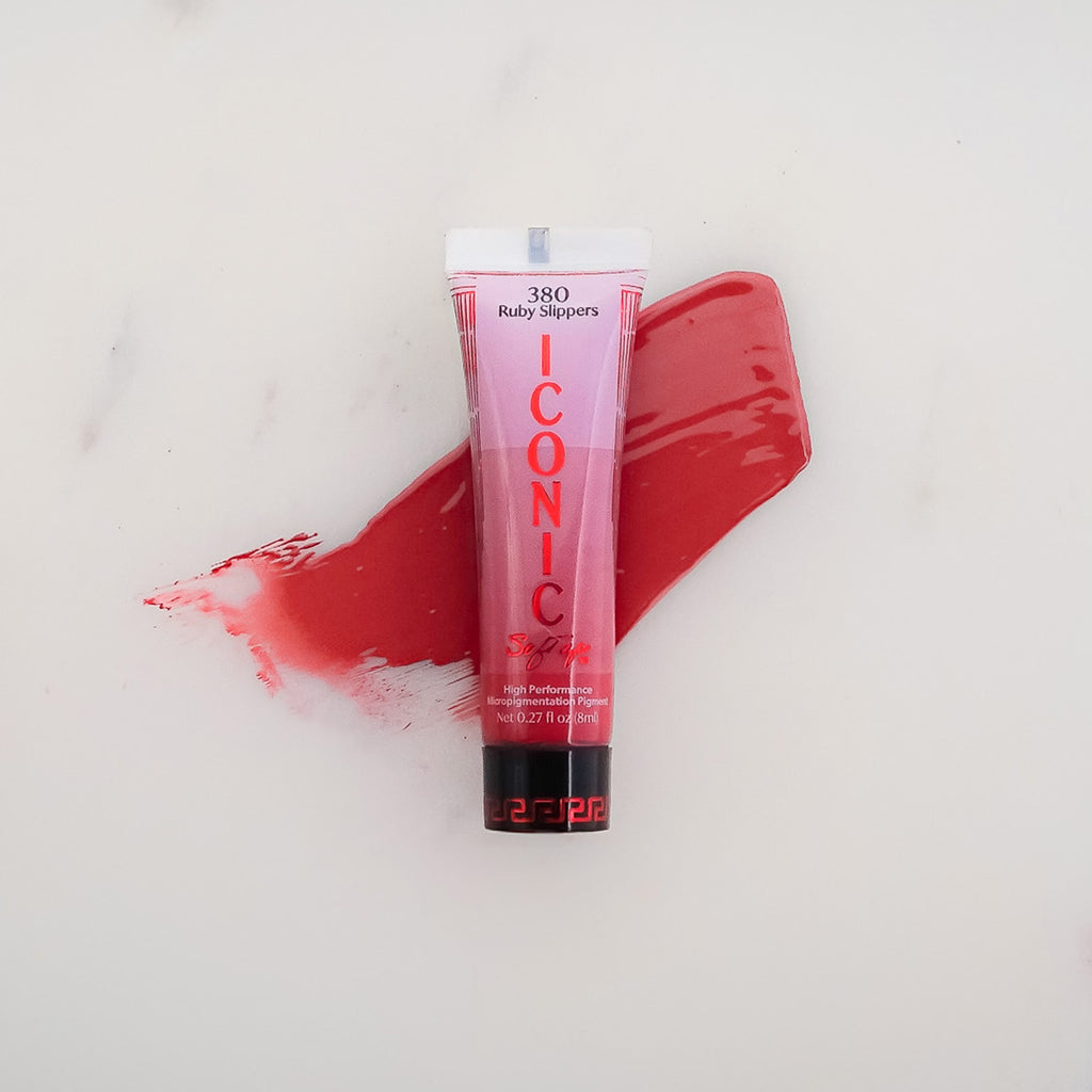 SofTap permanent makeup Iconic pigment Ruby Slippers tube with color swatch on marble background