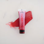 SofTap permanent makeup Iconic pigment Ruby Slippers tube with color swatch on marble background