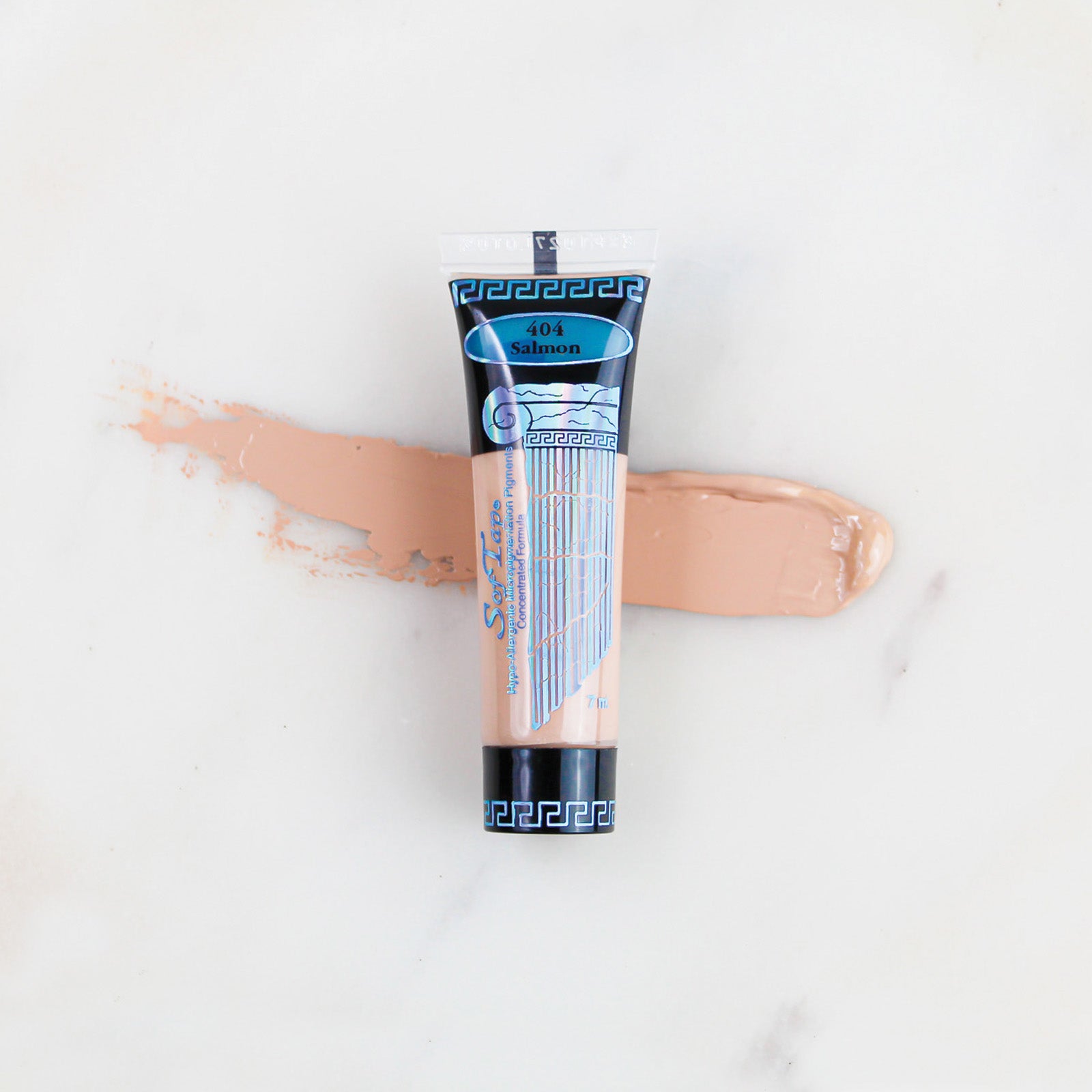SofTap permanent makeup pigment Salmon tube with color swatch on marble background