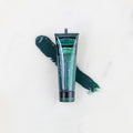 SofTap permanent makeup pigment Tempting Teal tube with color swatch on marble background