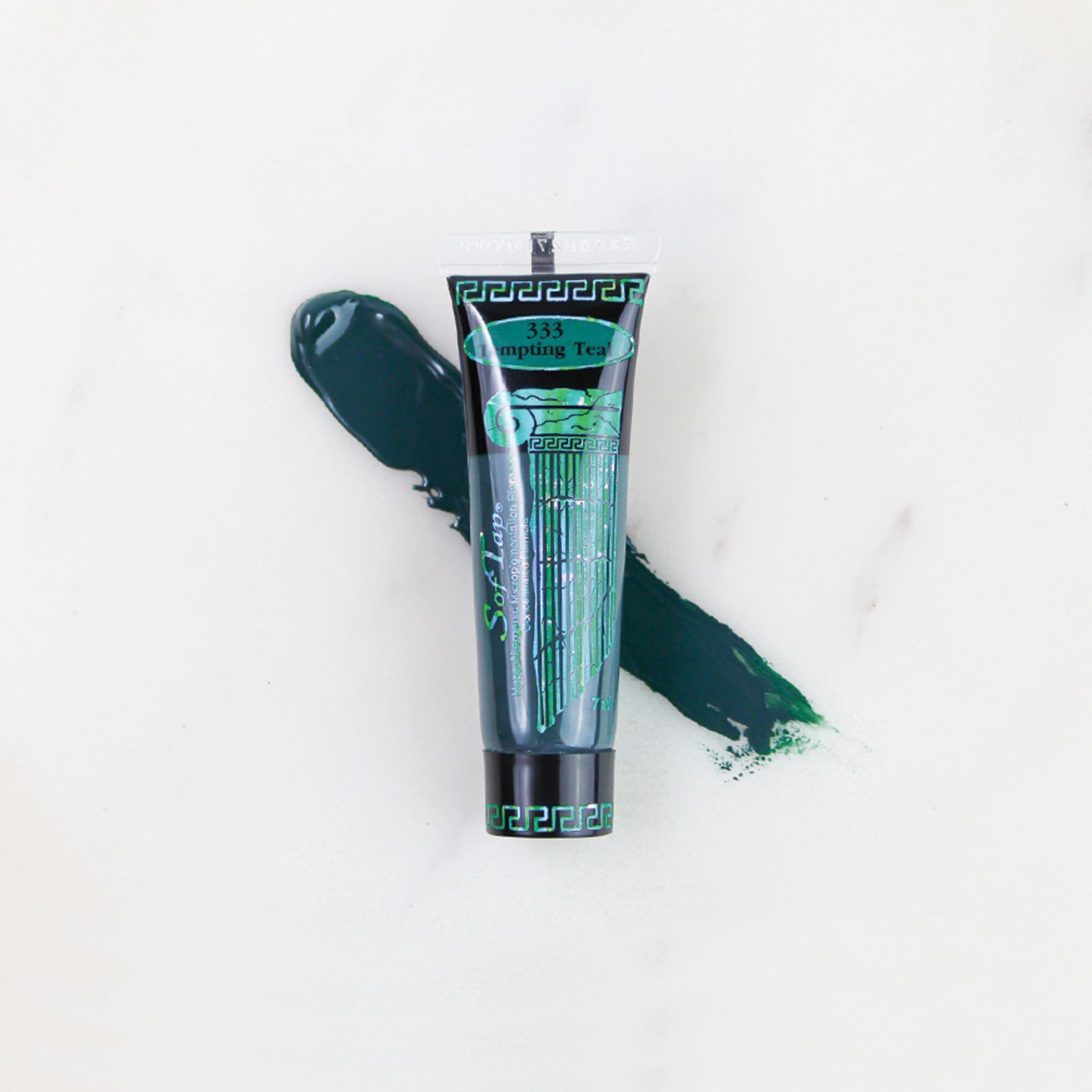 SofTap permanent makeup pigment Tempting Teal tube with color swatch on marble background