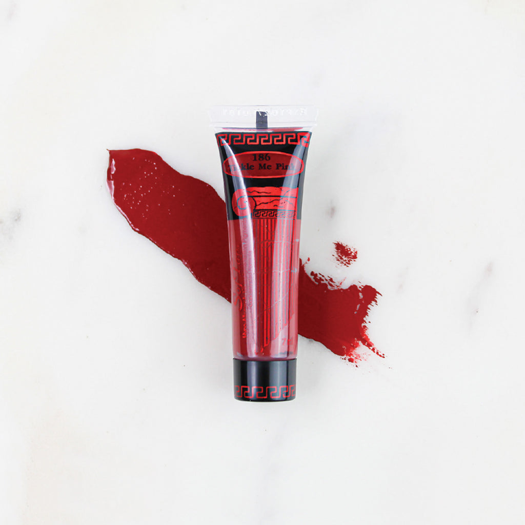 SofTap permanent makeup pigment Tickle Me Pink tube with color swatch on marble background