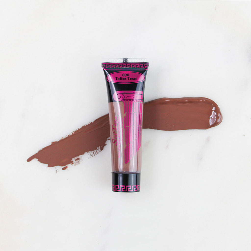 SofTap permanent makeup pigment Toffee Treat tube with color swatch on marble background
